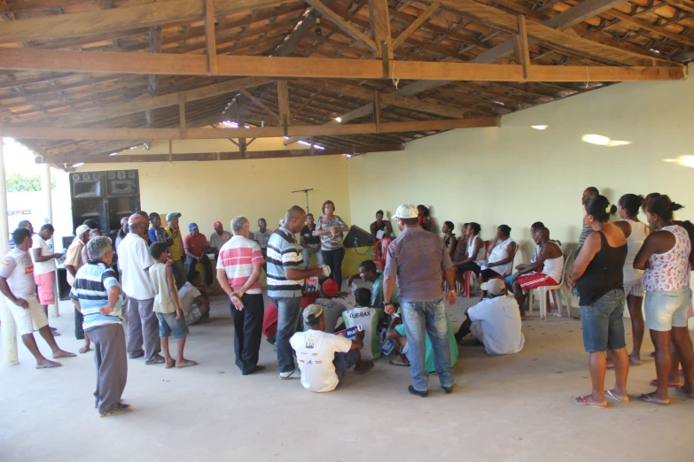 a group of people standing around in a building