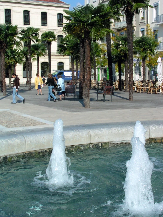 fountains show a number of people on their way to the beach