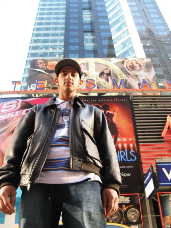 a person standing outside of a building with a jacket on