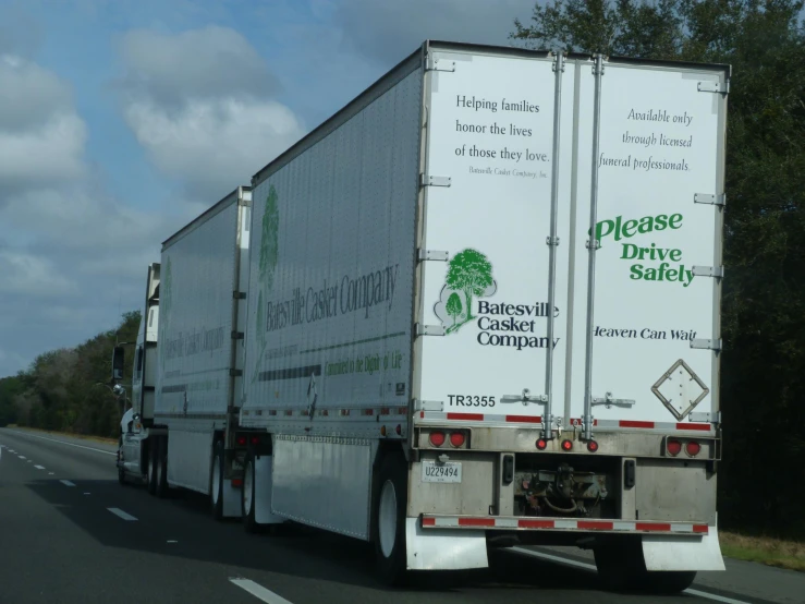 a large semi truck traveling down the road