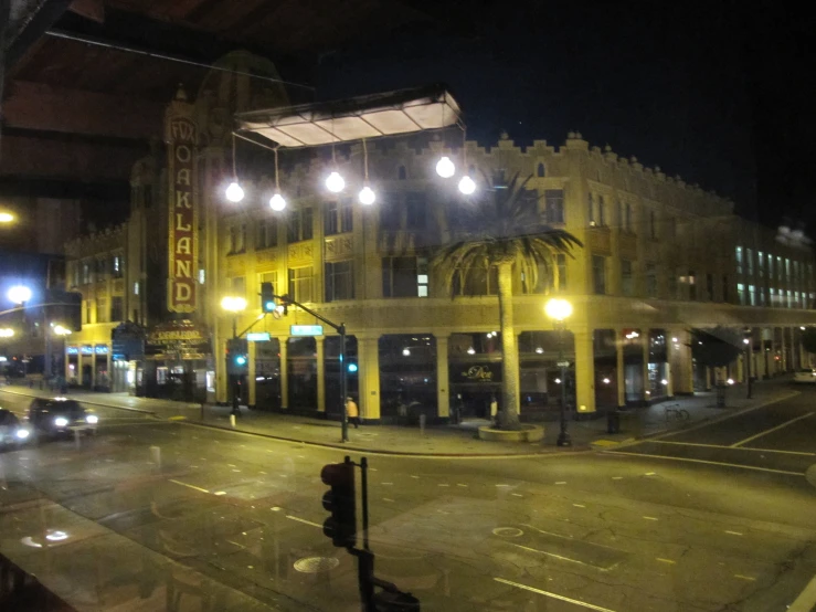 an empty street with some lights and cars