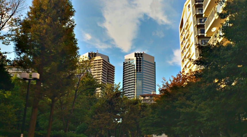 a picture taken from the ground looking at buildings in the distance