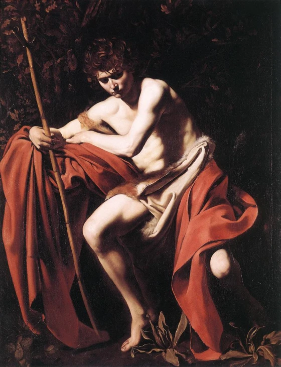 a painting that is of a male sitting on the ground