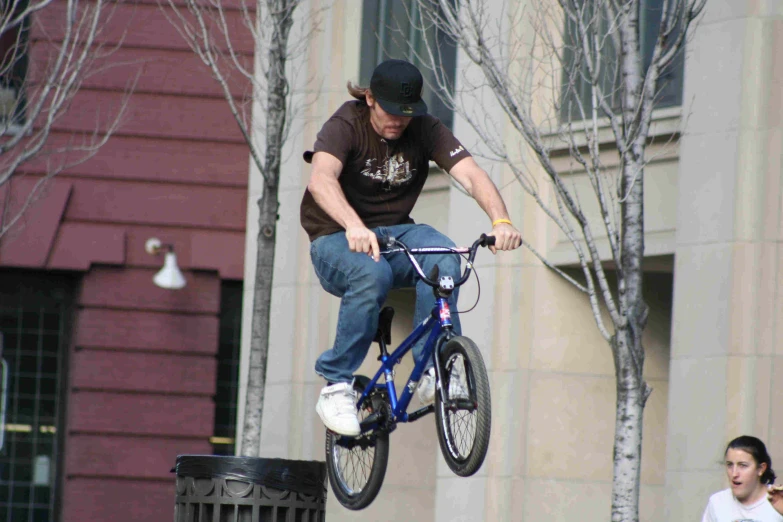 a man jumping with his bike in the air