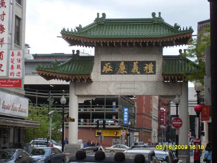 a busy asian city street has signs on each side