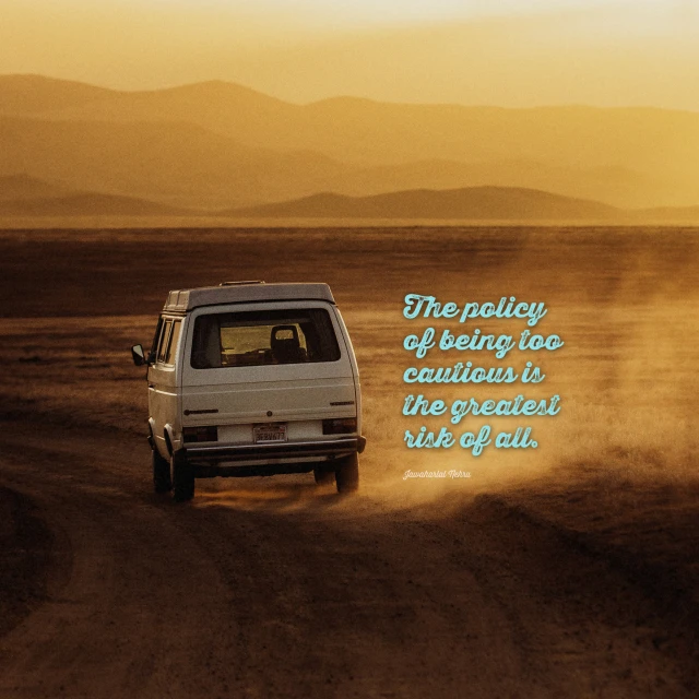 a van driving on top of a dirt road