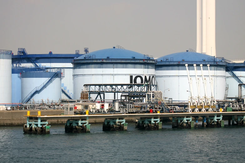 industrial facility sitting out on a lake near a harbor