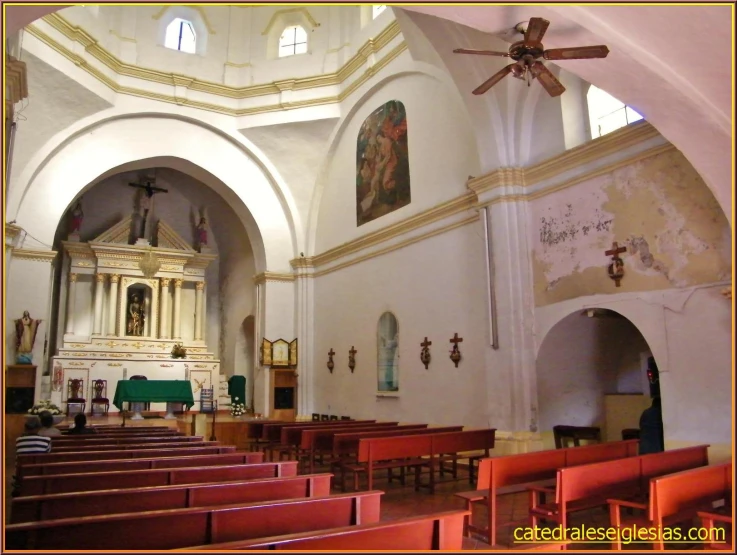 a po of inside an old church from the rear