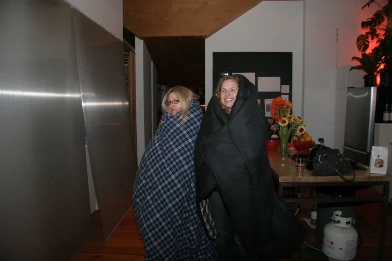 a woman and man standing together in an elevator