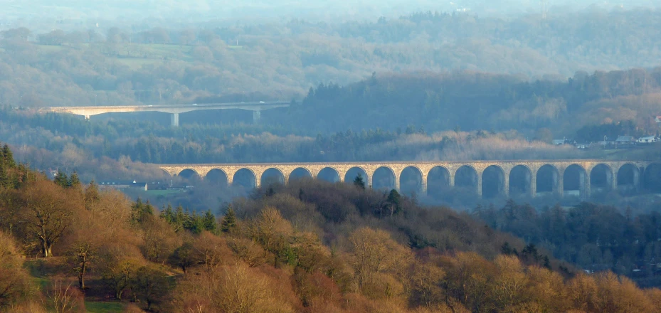 there is an old, viaduct on the hillside