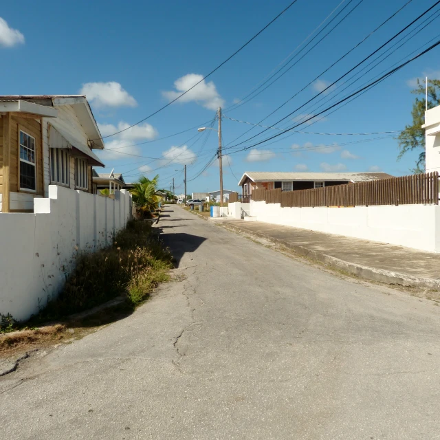 a narrow street has buildings near the top