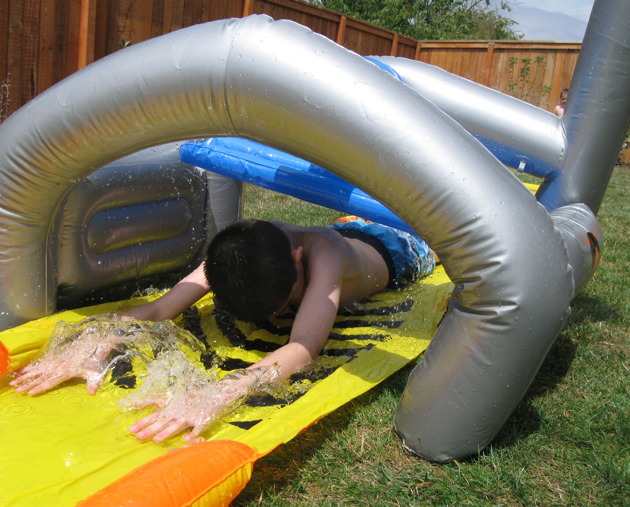 a person laying on an inflatable play ground