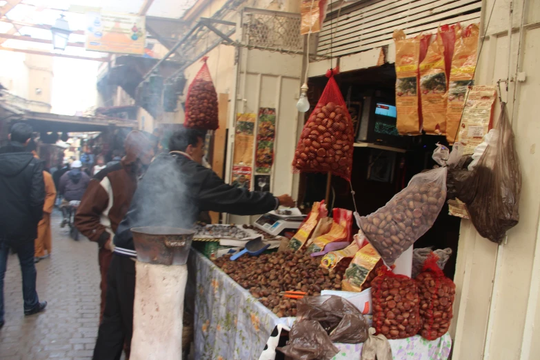 a store front selling many different kinds of meat and beans