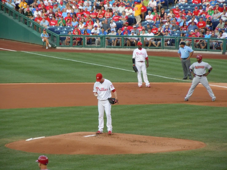 a couple of men are playing a game of baseball