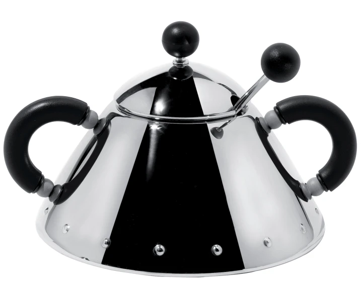 a black and silver tea pot with spoons in the front