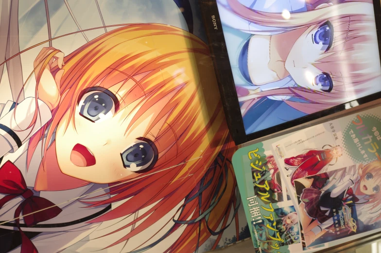 the anime screens are on display on the table
