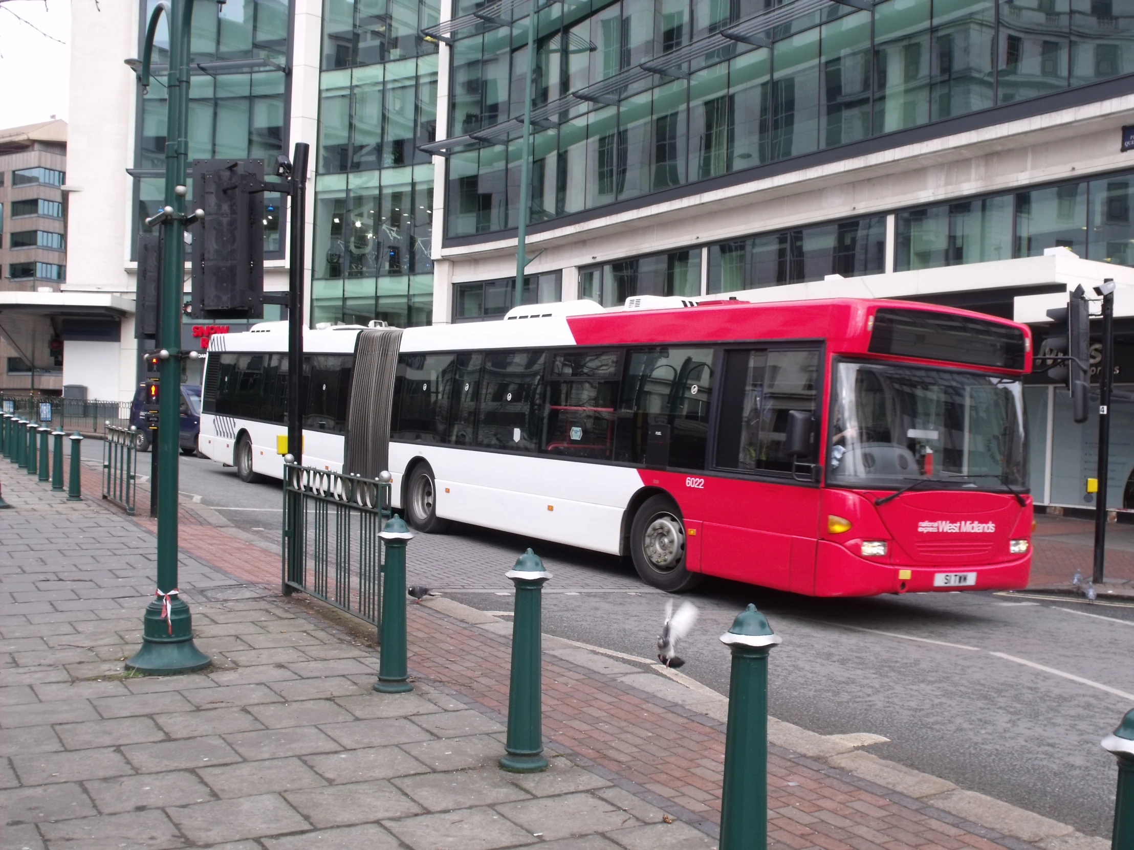 a city bus that is driving down the road