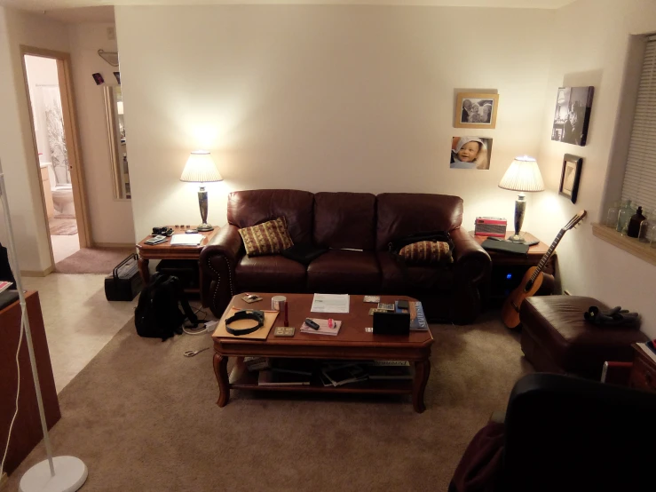 the couch and tables are arranged in a large room