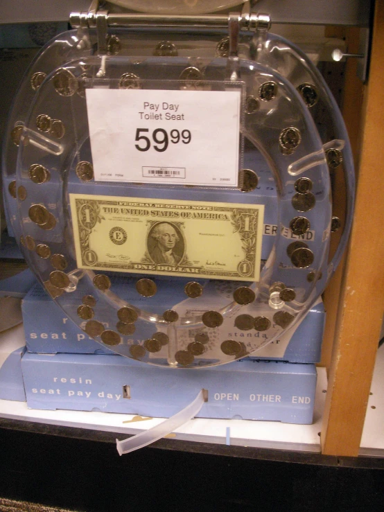 a display case for coins inside of a glass case