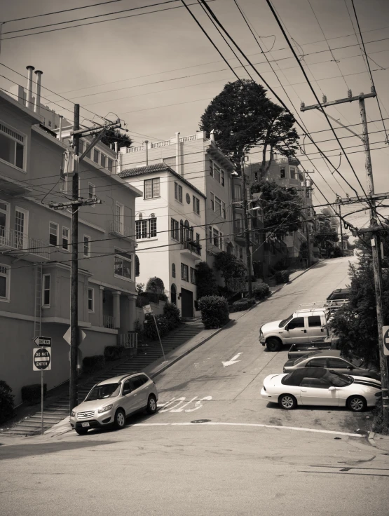 a black and white po of cars parked on a road