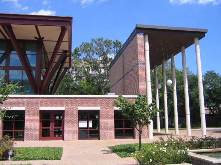 two large columns and three separate red doors