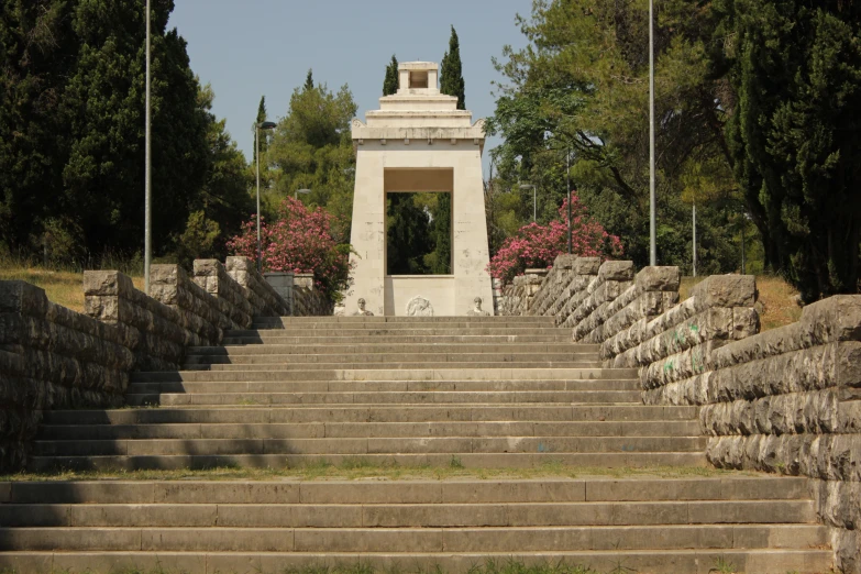 some steps and pillars leading to a monument