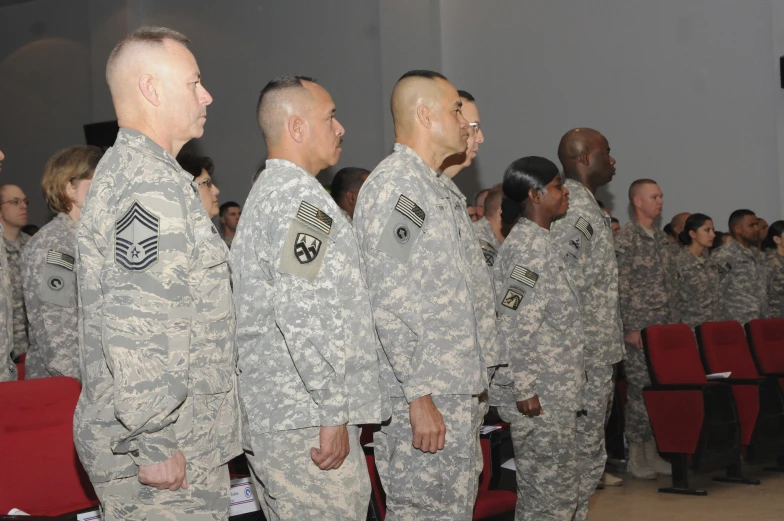 military men stand in formation next to each other