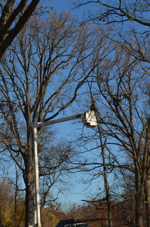 a car is parked in front of the street lamp