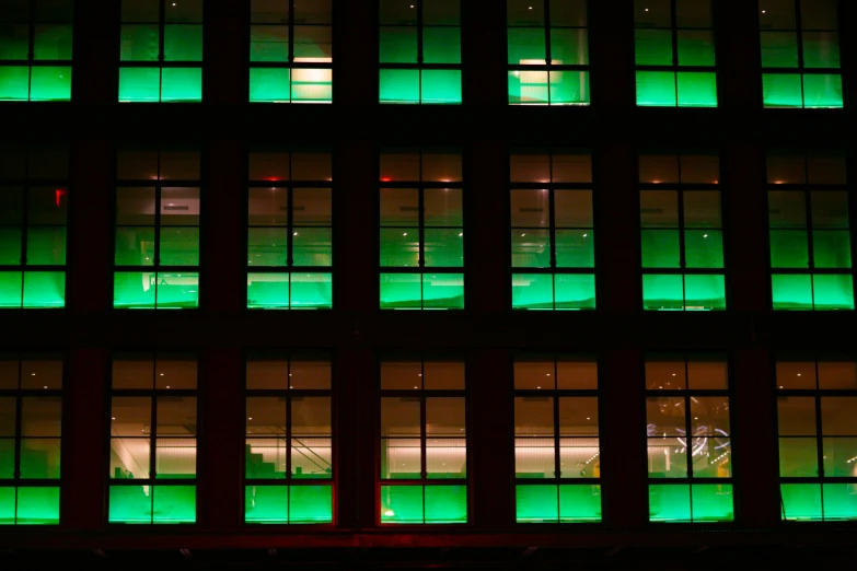 bright lights reflected in the windows of a building