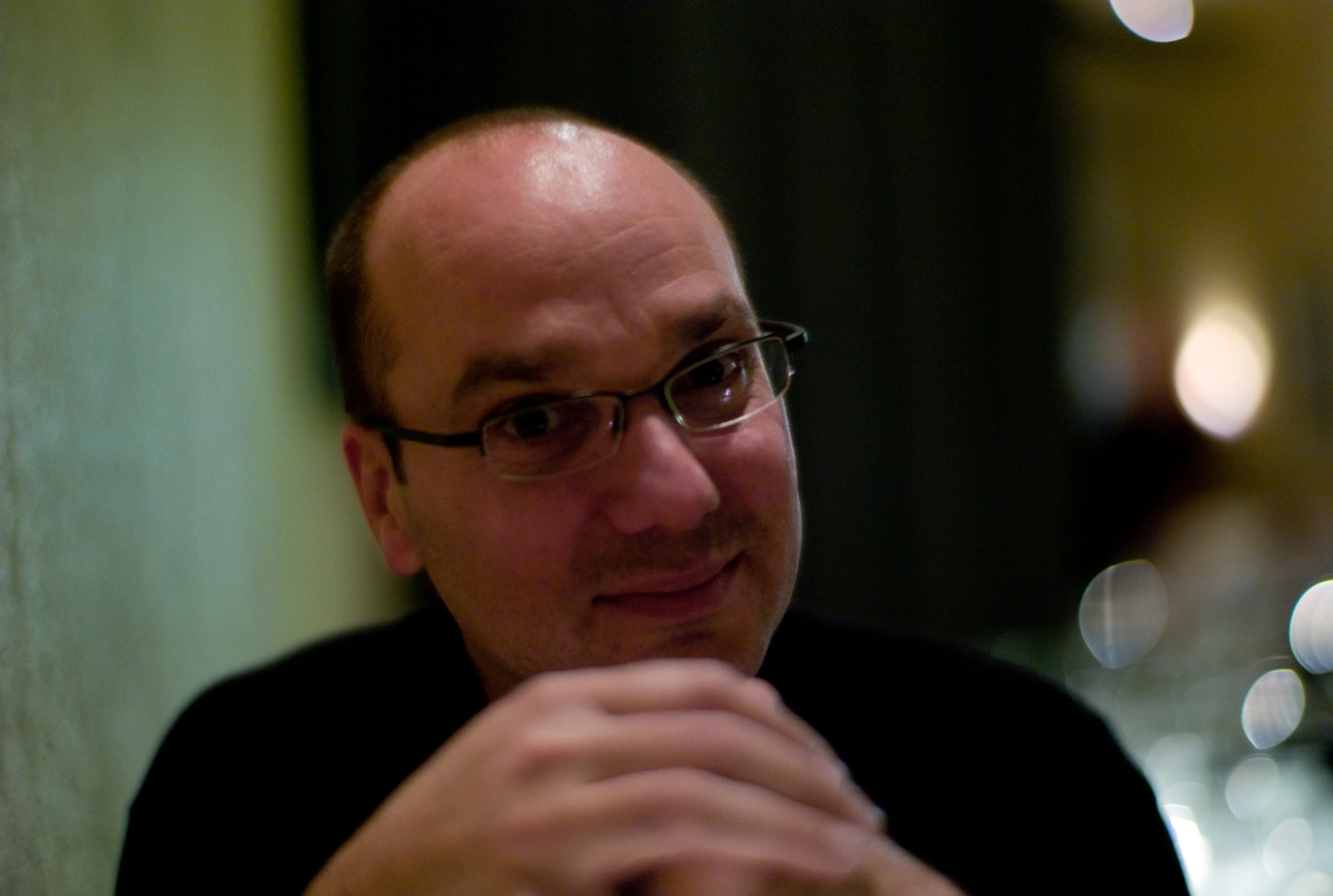 a man that is sitting down in front of a plate