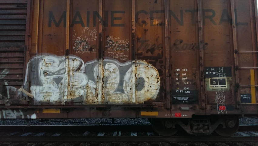 some graffiti on the side of a train car