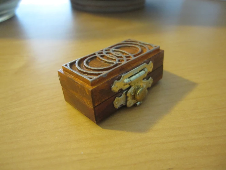 an old wooden toy box on the table