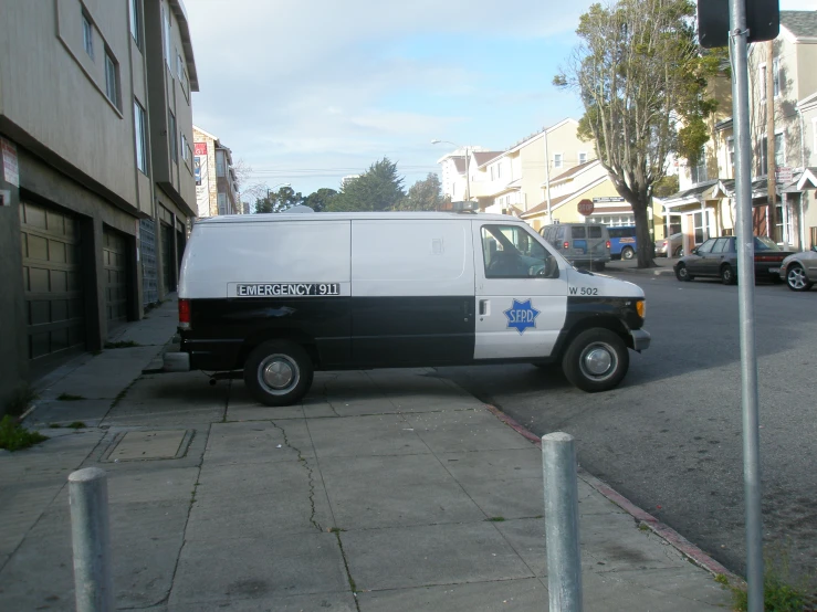 the small van has a black and white color scheme