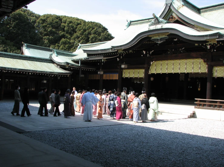 many people standing at a shrine