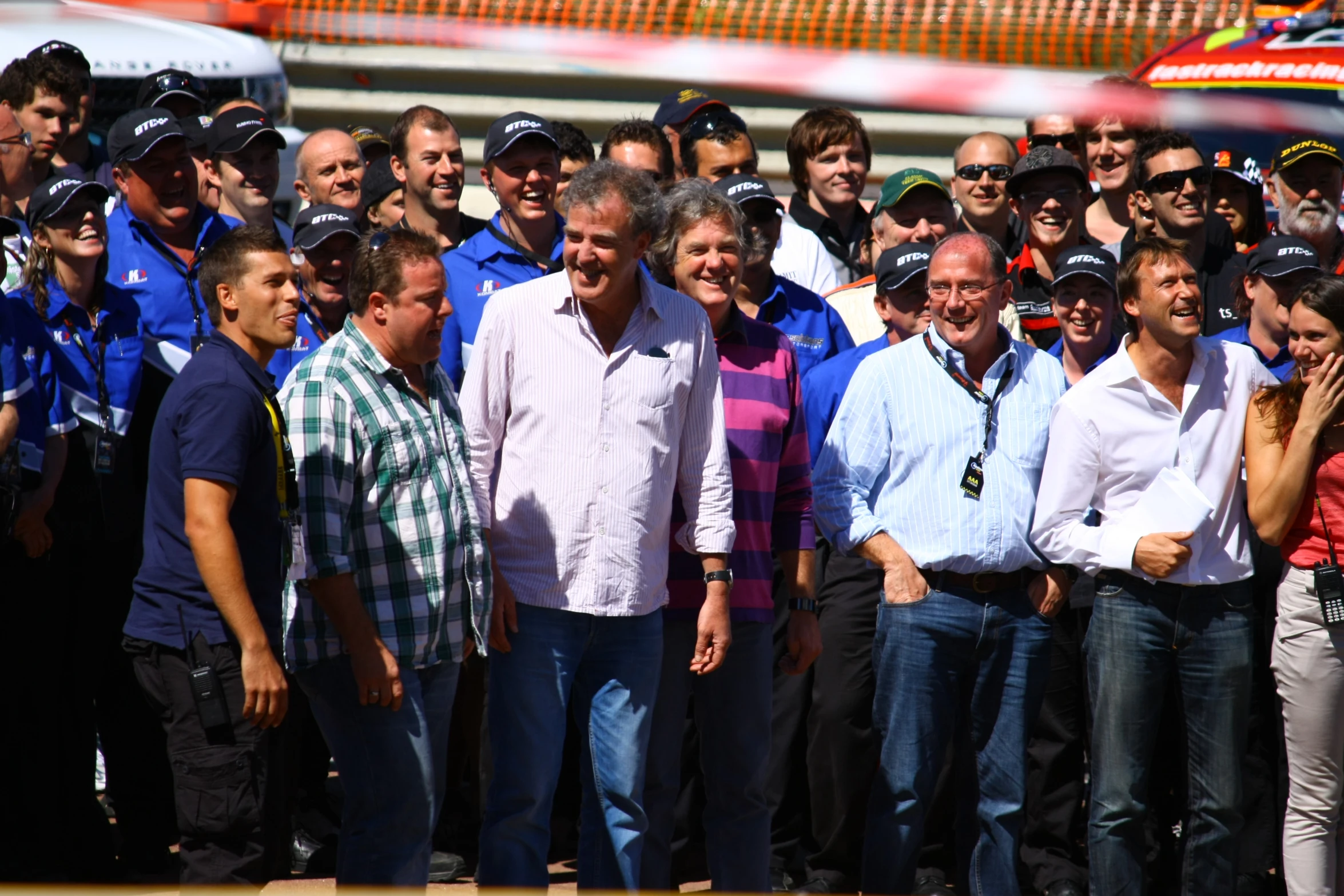 a group of people standing together in a large crowd