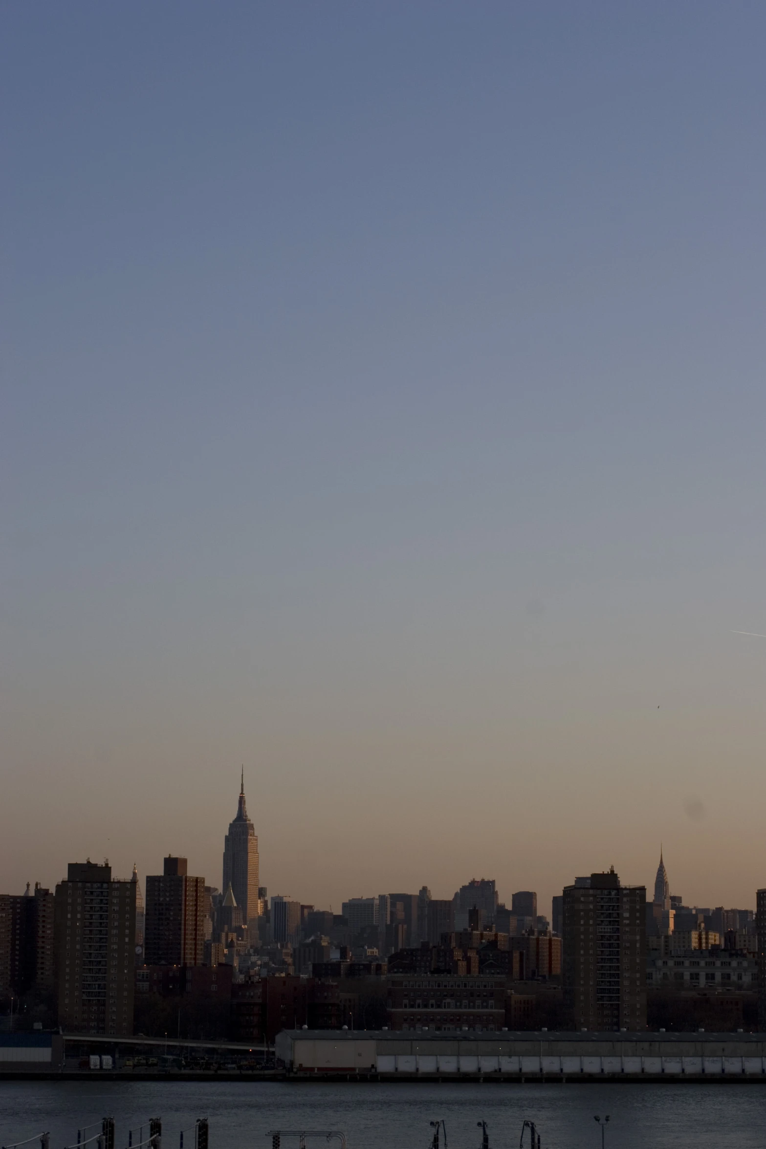 the view from the river shows the empire city and skyscrs