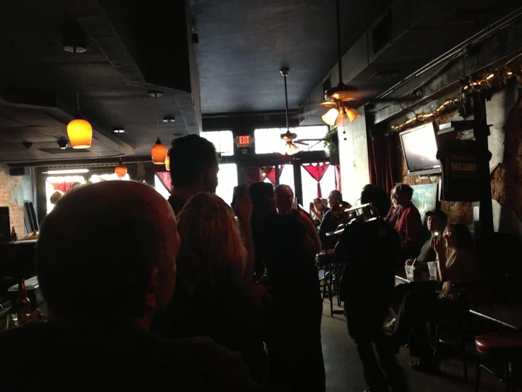 people are waiting in line at a restaurant