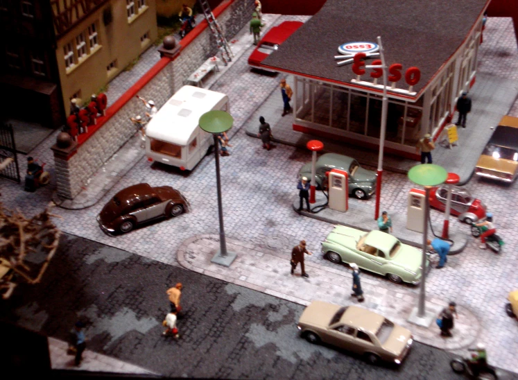 a city with several toy cars and people