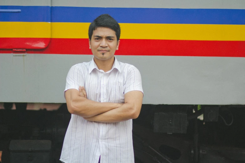 a man standing in front of a train