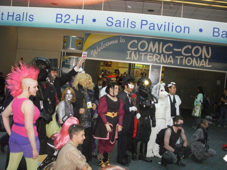 many people in costume at a convention outside