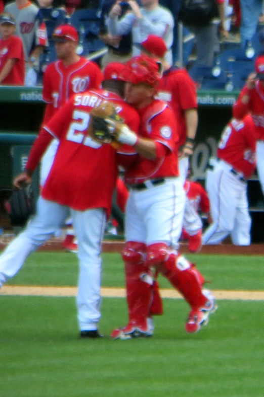 a group of baseball players are playing baseball on the field