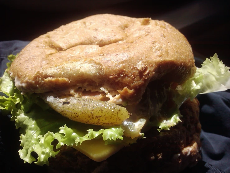 a hamburger is on a black table