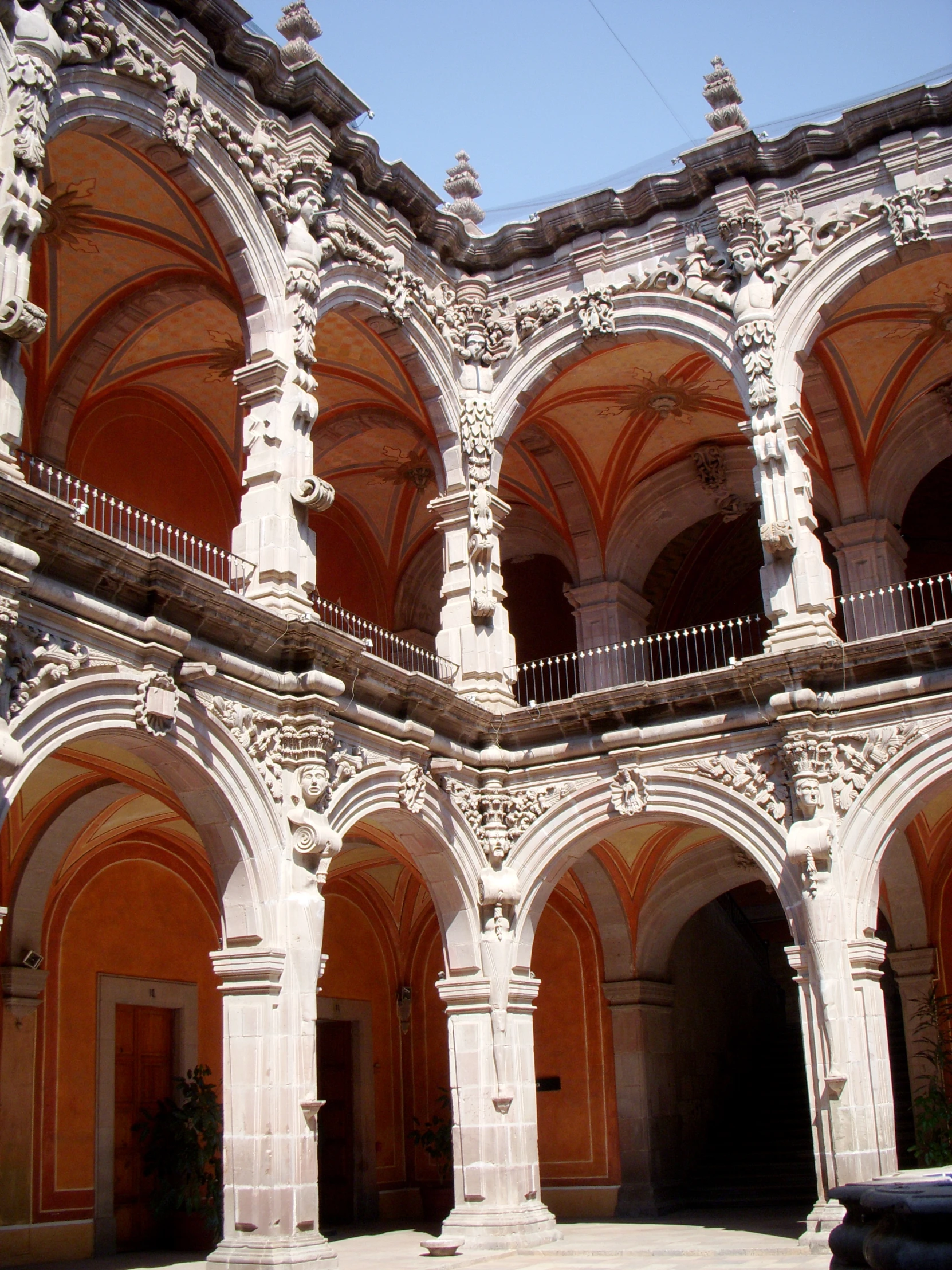 arches and pillars line an arched building