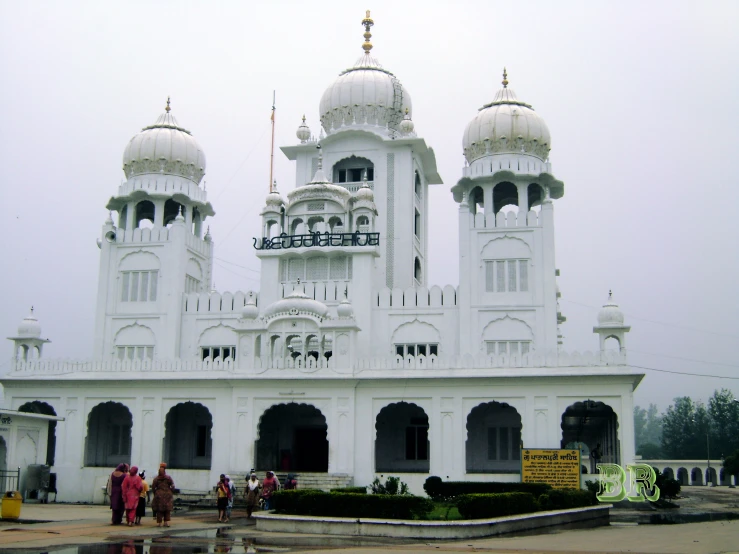 the white building is ornate and elaborately decorated