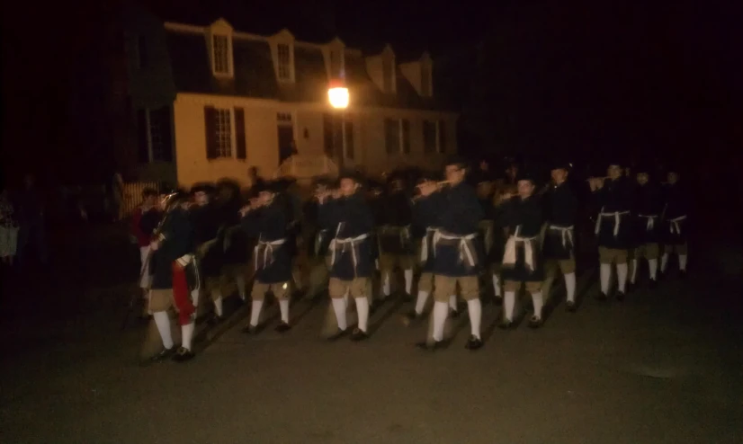 a band of people are lined up in formation