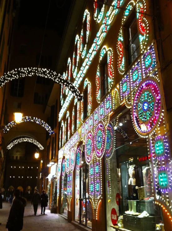 the building is covered in many colorful lights