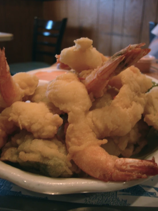 a plate of food, consisting of shrimp and cauliflower