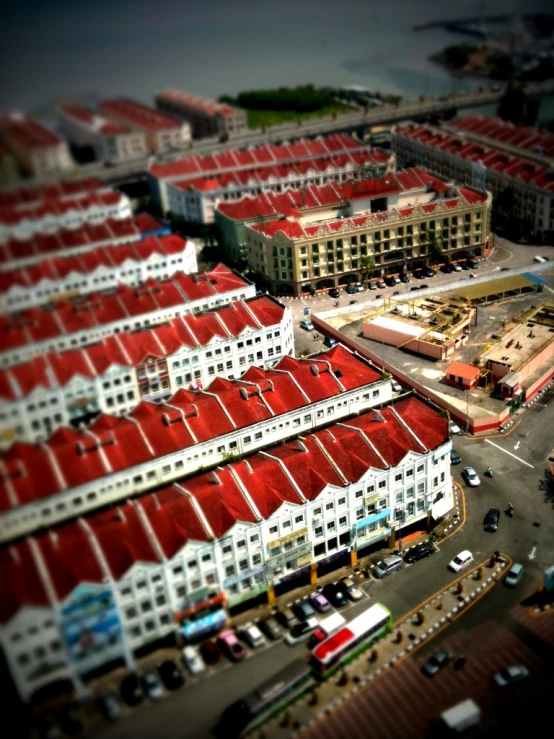 an aerial view of a parking lot near a building