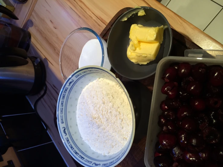 some bowls filled with food on top of a counter