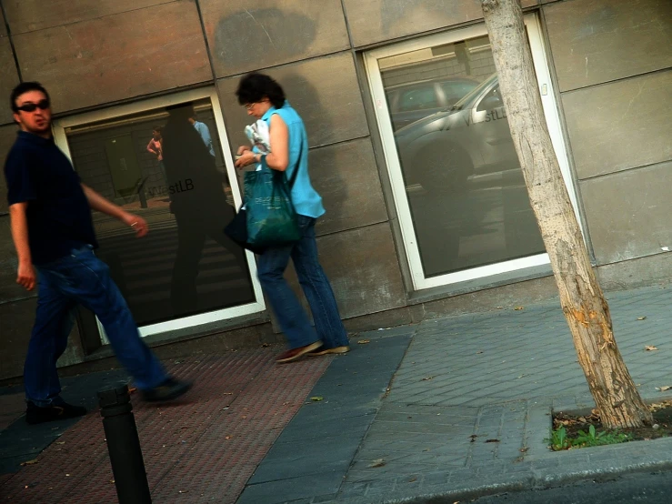 two people on the side of a building